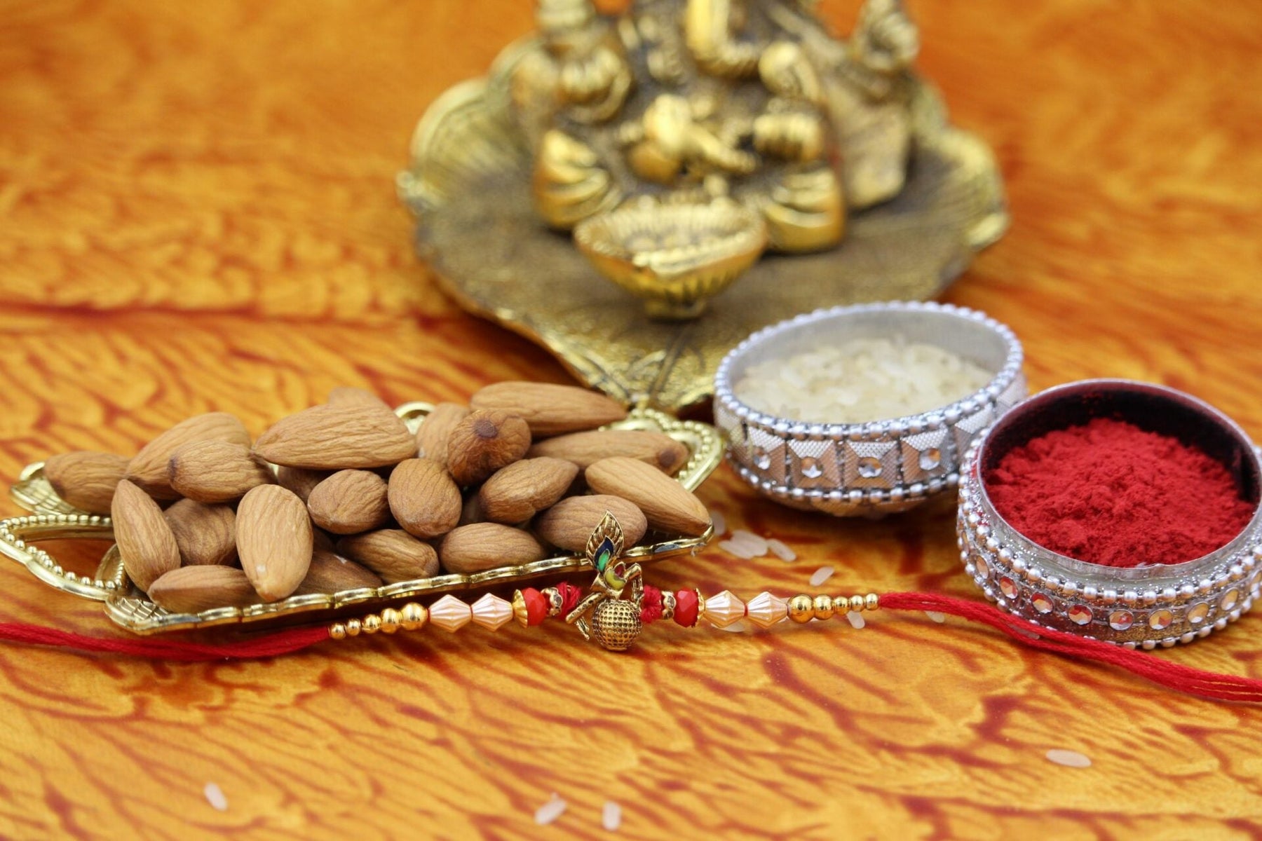 Bansuri Rakhi With Almonds