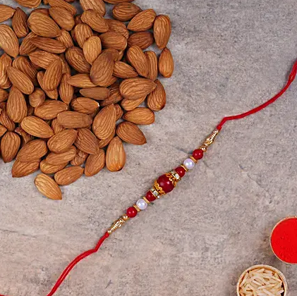 Elegant Pearl Thread Rakhi And Almonds
