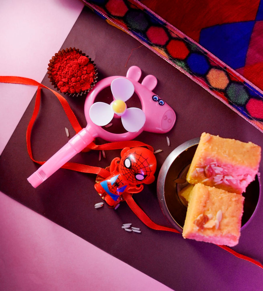 Patisa slice with Peppa Pig and Spider Man Rakhi