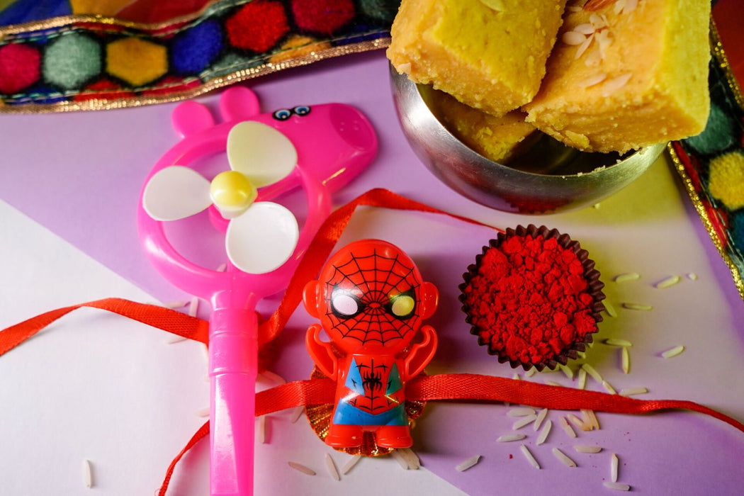 Patisa slice with Peppa Pig and Spider Man Rakhi
