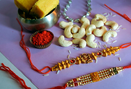 Batisa Slice with Cashewnuts and Elegant Ganesha Rakhi Set.