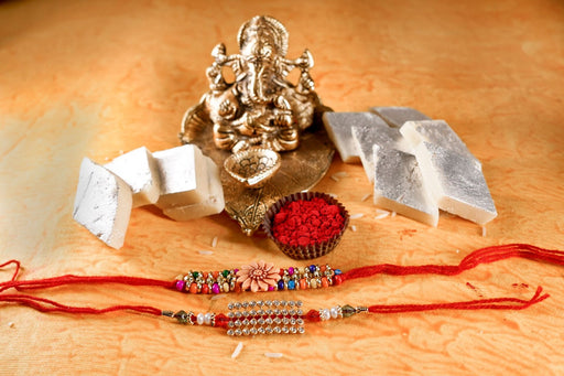 Unique Pearl and Beads Rakhi Set with Kaju Katli.