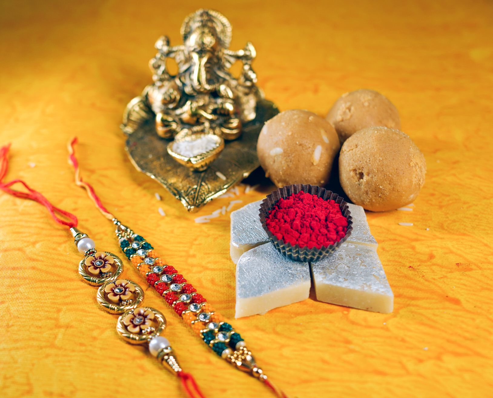 Kaju Katli and Besan Laddoo with Attractive Beads Rakhi Set