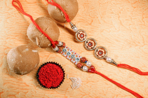Red and Golden Beads with rudraksh Rakhi with Besan Ladoo