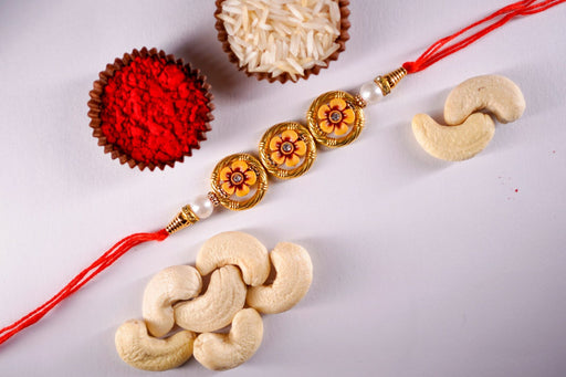 Designer Golden Beads Rakhi With Cashewnuts
