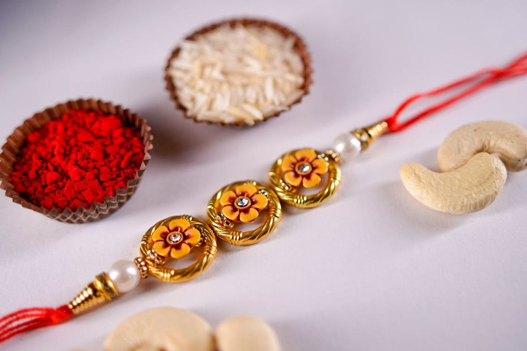 Designer Golden Beads Rakhi With Cashewnuts