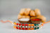Kesar Peda Paired with Colourful Beads Rakhi