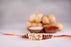 Kesar Peda Paired with Flower and Beads Rakhi