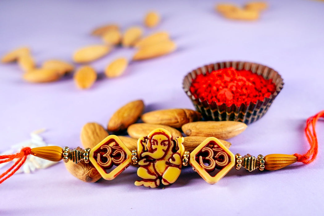 Ethnic OM Rakhi  with Almonds