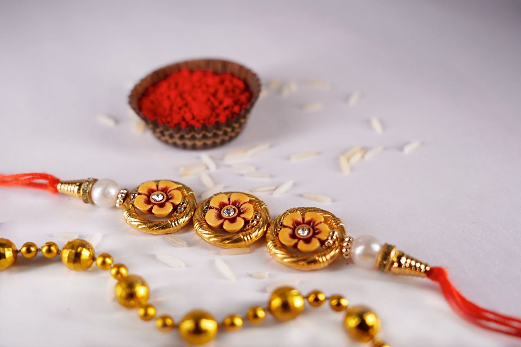 Beads Rakhi- 3 Flower Rakhi