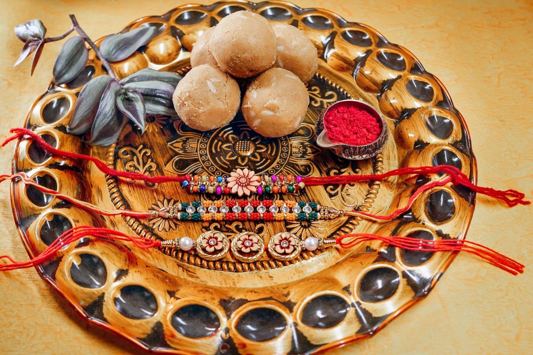 Multiple Pearls ,Designer Golden Beads and Beads Rakhi Set with 200 gm Besan Laddoo