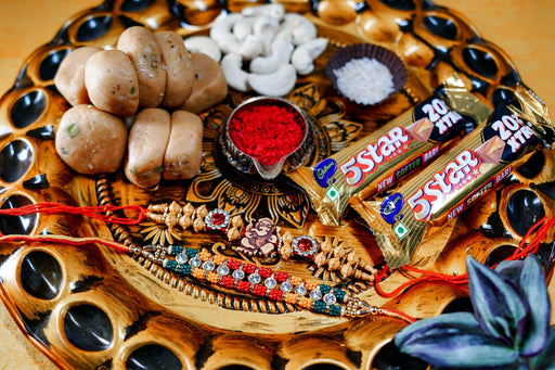 Beads Rakhi Ganesha Om and Beads Rakhi with 200gm Kesar Peda + 200gm Cashewnuts + 5 Star Chocolates